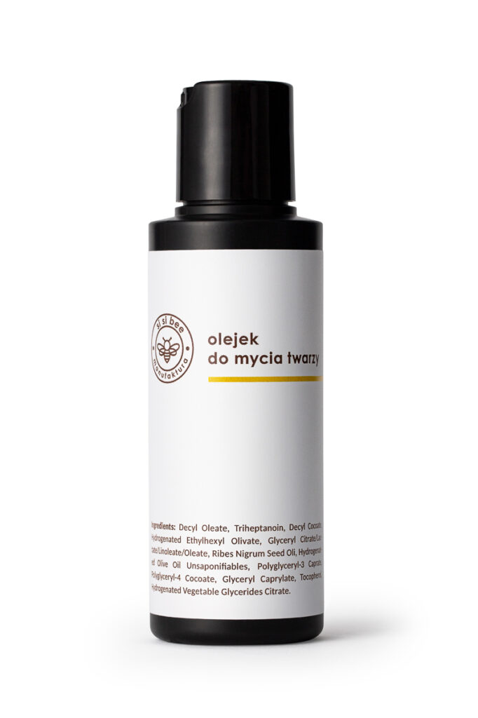 Olejek do mycia twarzy w czarnej butelce – packshot kosmetyku na białym tle